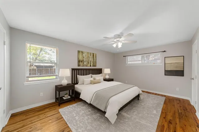 a bedroom with a large bed and a window