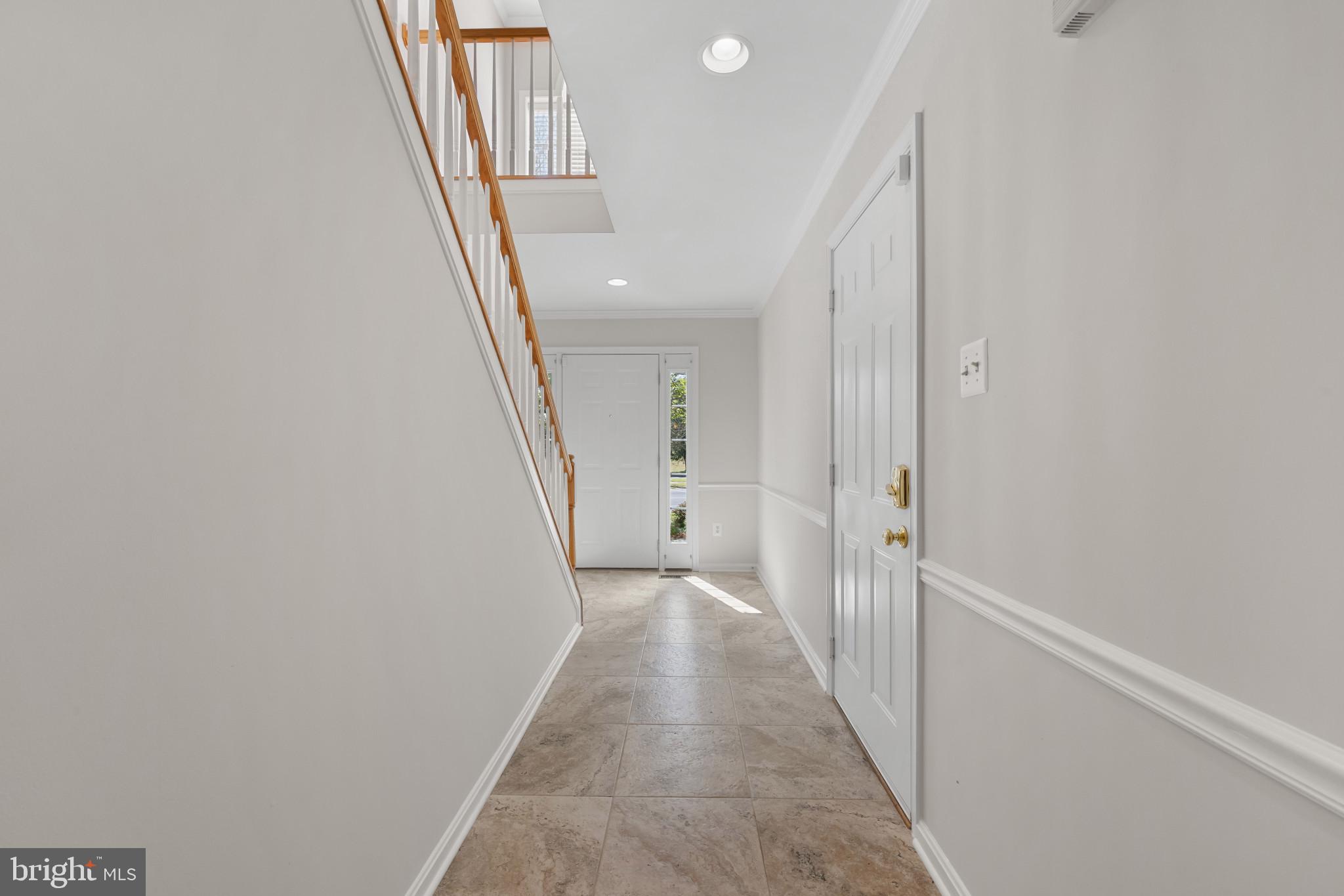 2603 Spartan Road Olney, MD 20832 - Photo 18 of 62 a view of a hallway with wooden floor and entryway