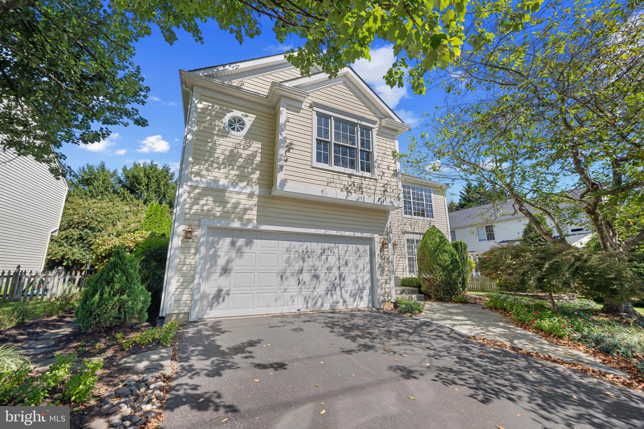 2603 Spartan Road Olney, MD 20832 - Photo 2 of 62 a front view of a house with a garden
