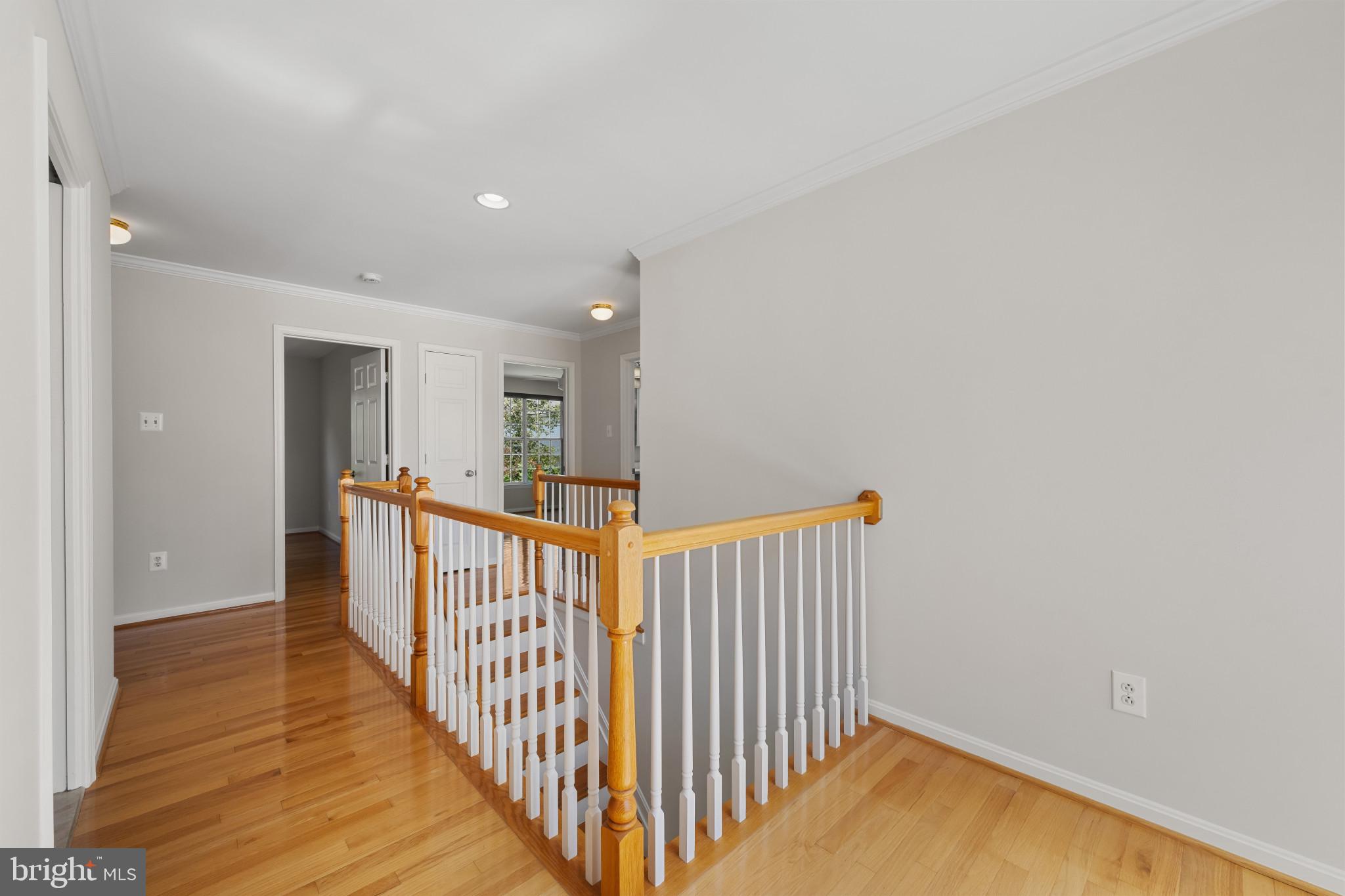 2603 Spartan Road Olney, MD 20832 - Photo 21 of 62 a view of a hallway with wooden floor