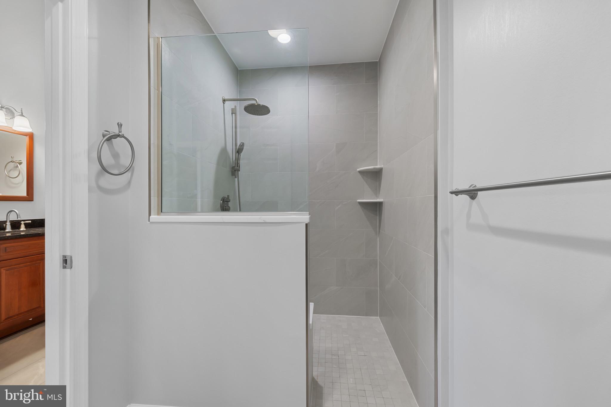 2603 Spartan Road Olney, MD 20832 - Photo 25 of 62 a bathroom with a sink and a mirror