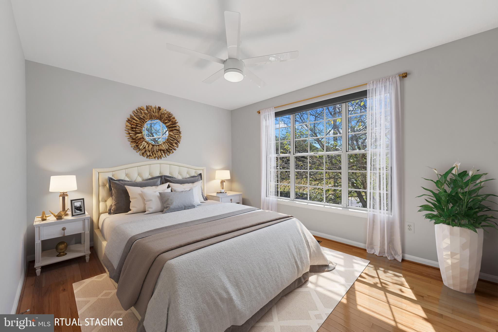 2603 Spartan Road Olney, MD 20832 - Photo 27 of 62 a bedroom with a large bed and a large window
