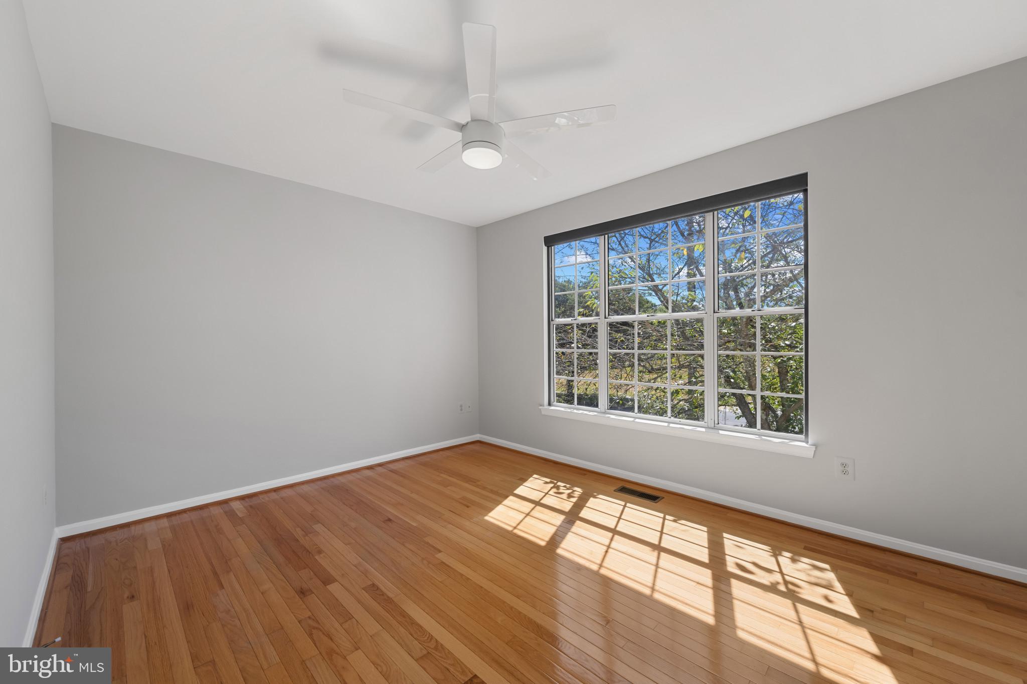 2603 Spartan Road Olney, MD 20832 - Photo 28 of 62 a view of an empty room with wooden floor and a window