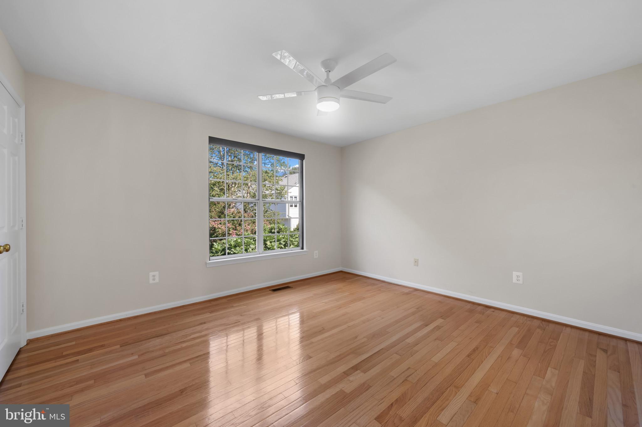2603 Spartan Road Olney, MD 20832 - Photo 36 of 62 a view of an empty room with wooden floor and a window