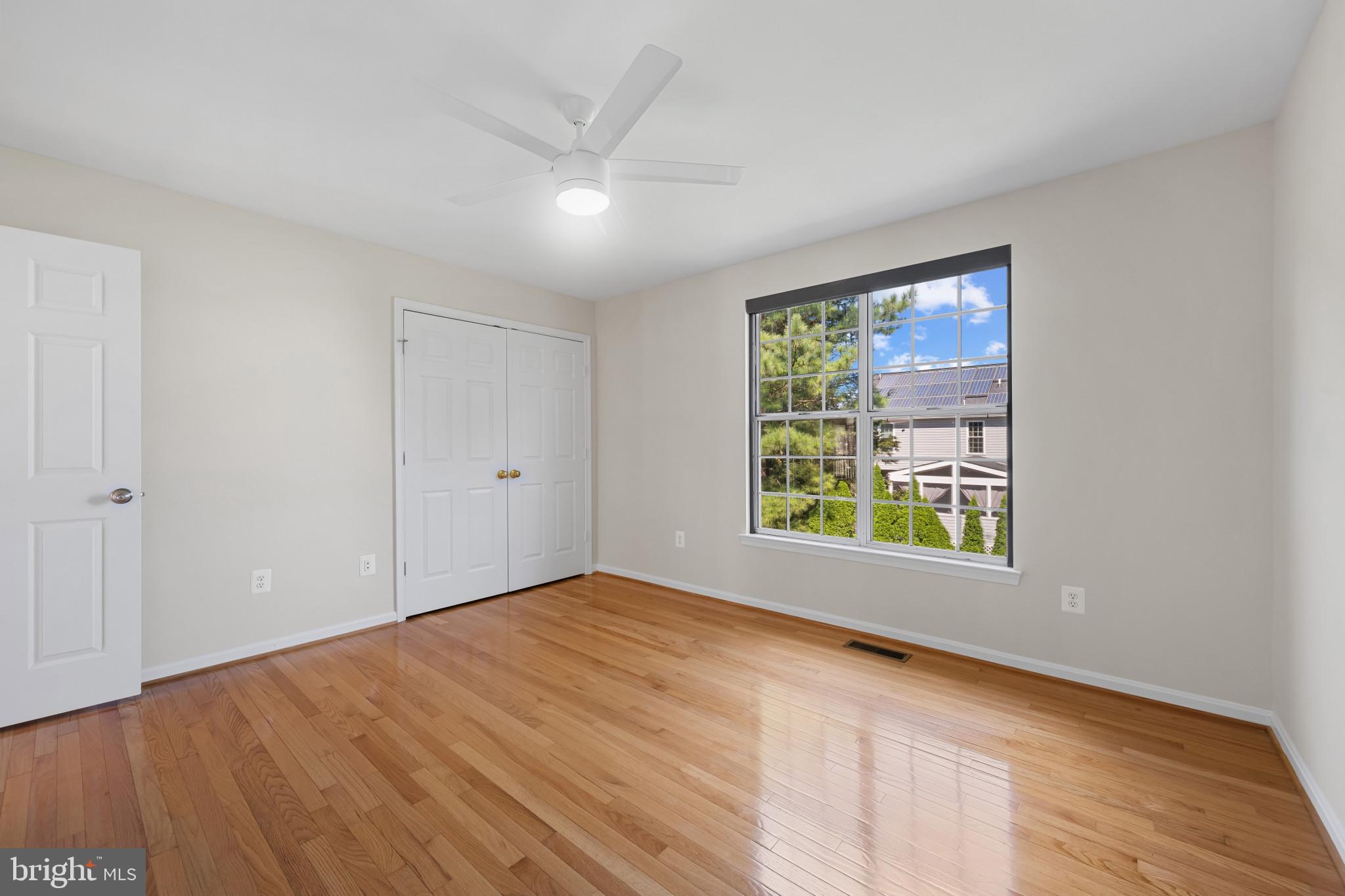 2603 Spartan Road Olney, MD 20832 - Photo 37 of 62 a view of an empty room with wooden floor and a window