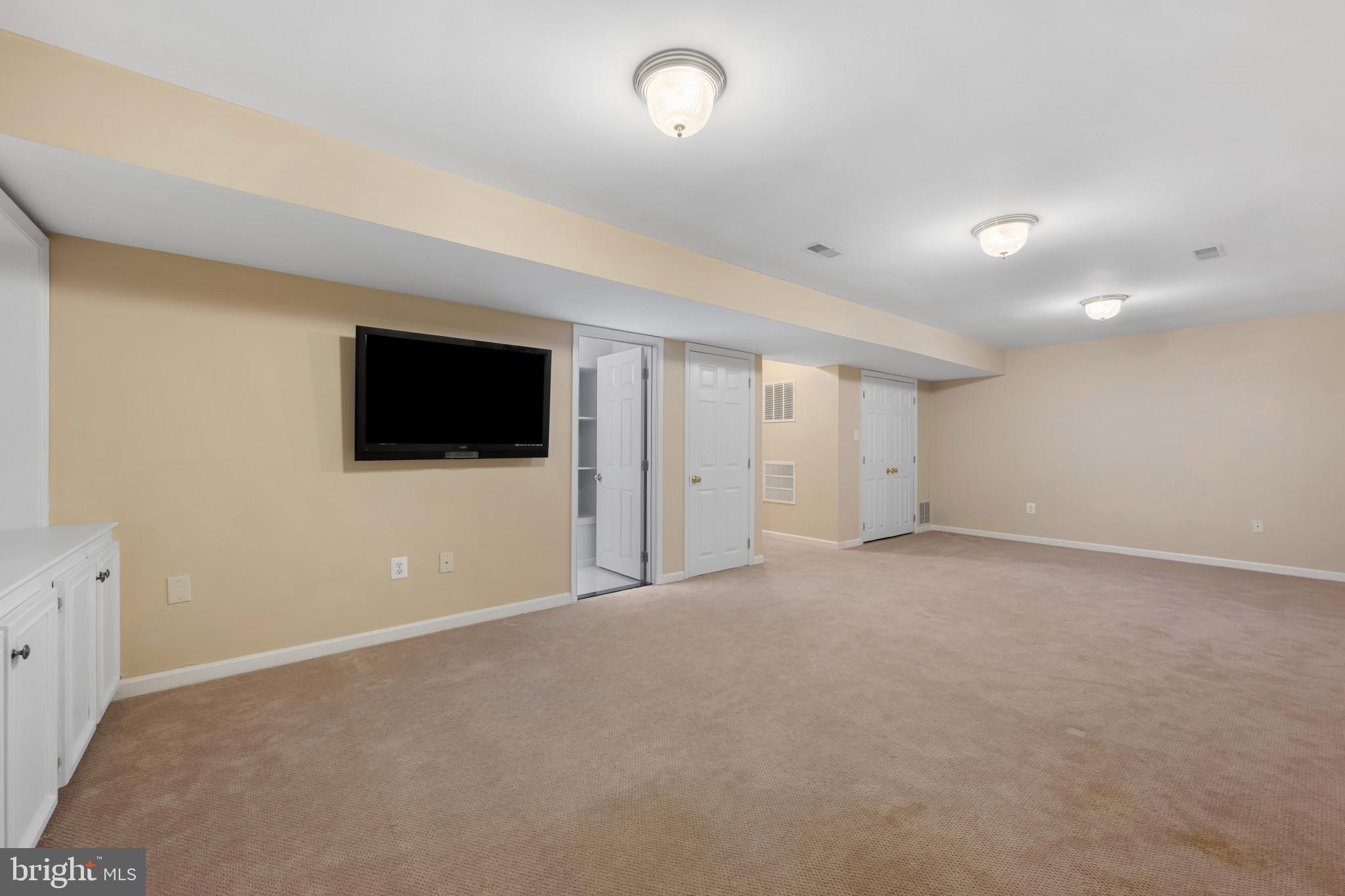 2603 Spartan Road Olney, MD 20832 - Photo 46 of 62 a view of an empty room with a flat screen tv