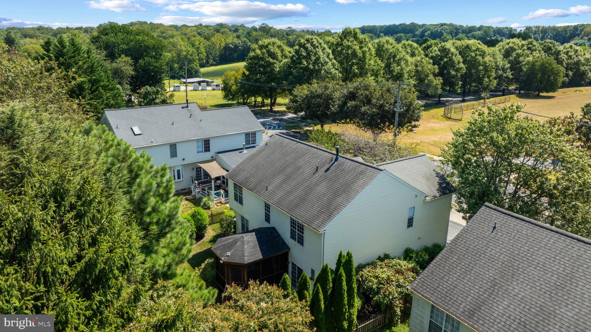 2603 Spartan Road Olney, MD 20832 - Photo 62 of 62 an aerial view of a house with a yard and trees