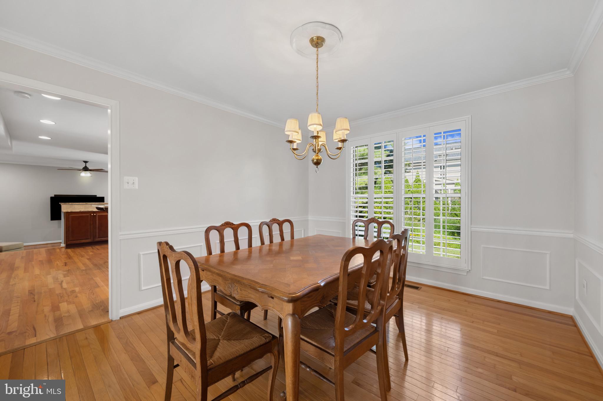 2603 Spartan Road Olney, MD 20832 - Photo 8 of 62 a view of a dining room with furniture window and wooden floor