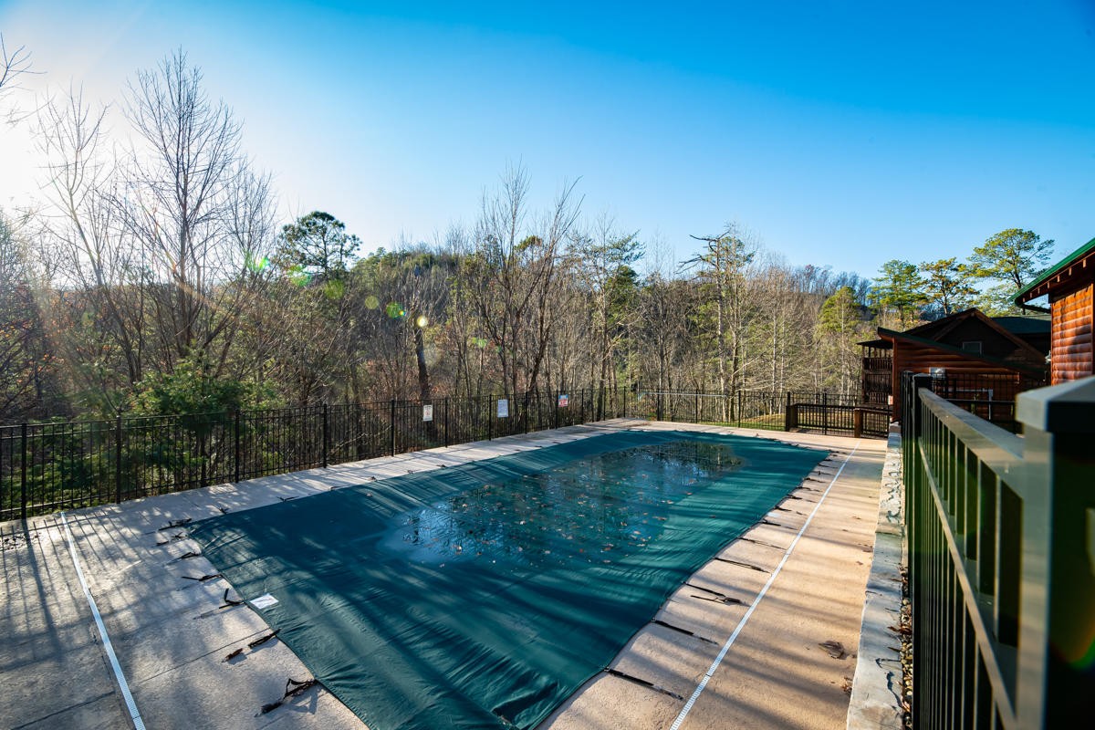 3126 Smoky Ridge Way Sevierville, TN 37862 - Photo 14 of 14 a swimming pool with a yard