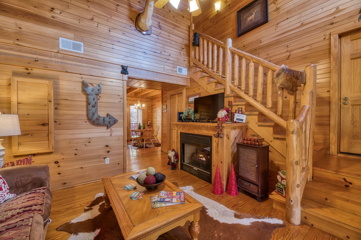 3126 Smoky Ridge Way Sevierville, TN 37862 - Photo 4 of 14 a living room with fireplace furniture and a wooden floor