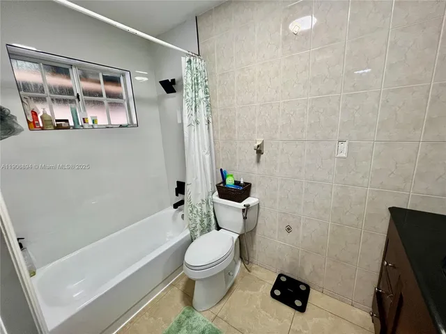 a bathroom with a toilet a sink and a bathtub