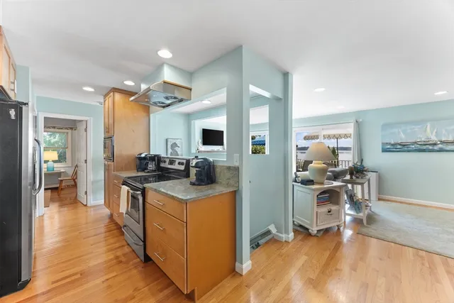 a view of a kitchen counter top space with stainless steel appliances