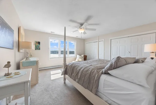 a bedroom with a bed and a desk