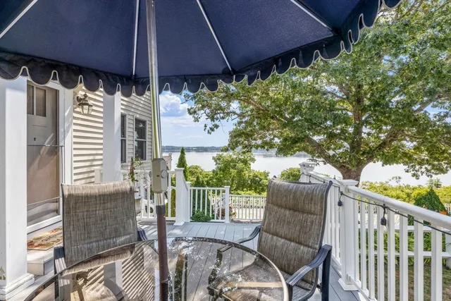 a view of a chair and table in the patio