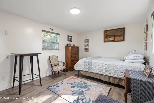 a bedroom with a bed and a table in it