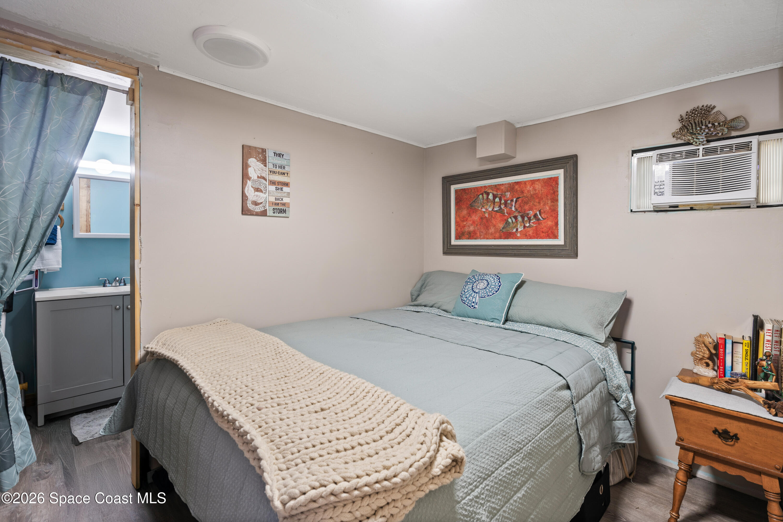 8280 Pine Ridge Trail Sebastian, FL 32976 - Photo 17 of 43 a bedroom with a bed and a couch