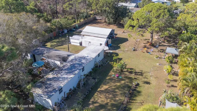 an aerial view of a house with swimming pool