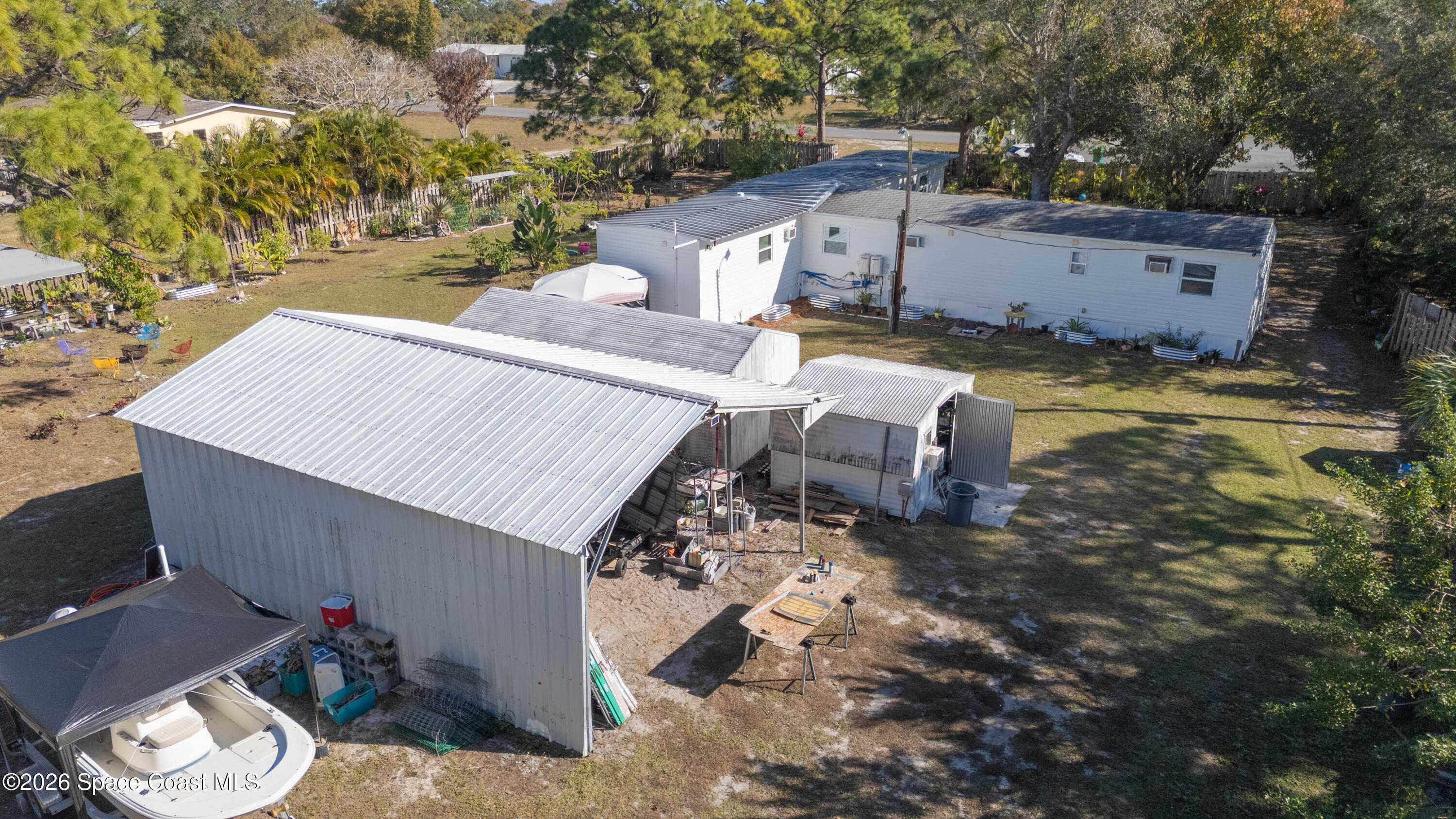 8280 Pine Ridge Trail Sebastian, FL 32976 - Photo 20 of 43 an aerial view of a house with swimming pool