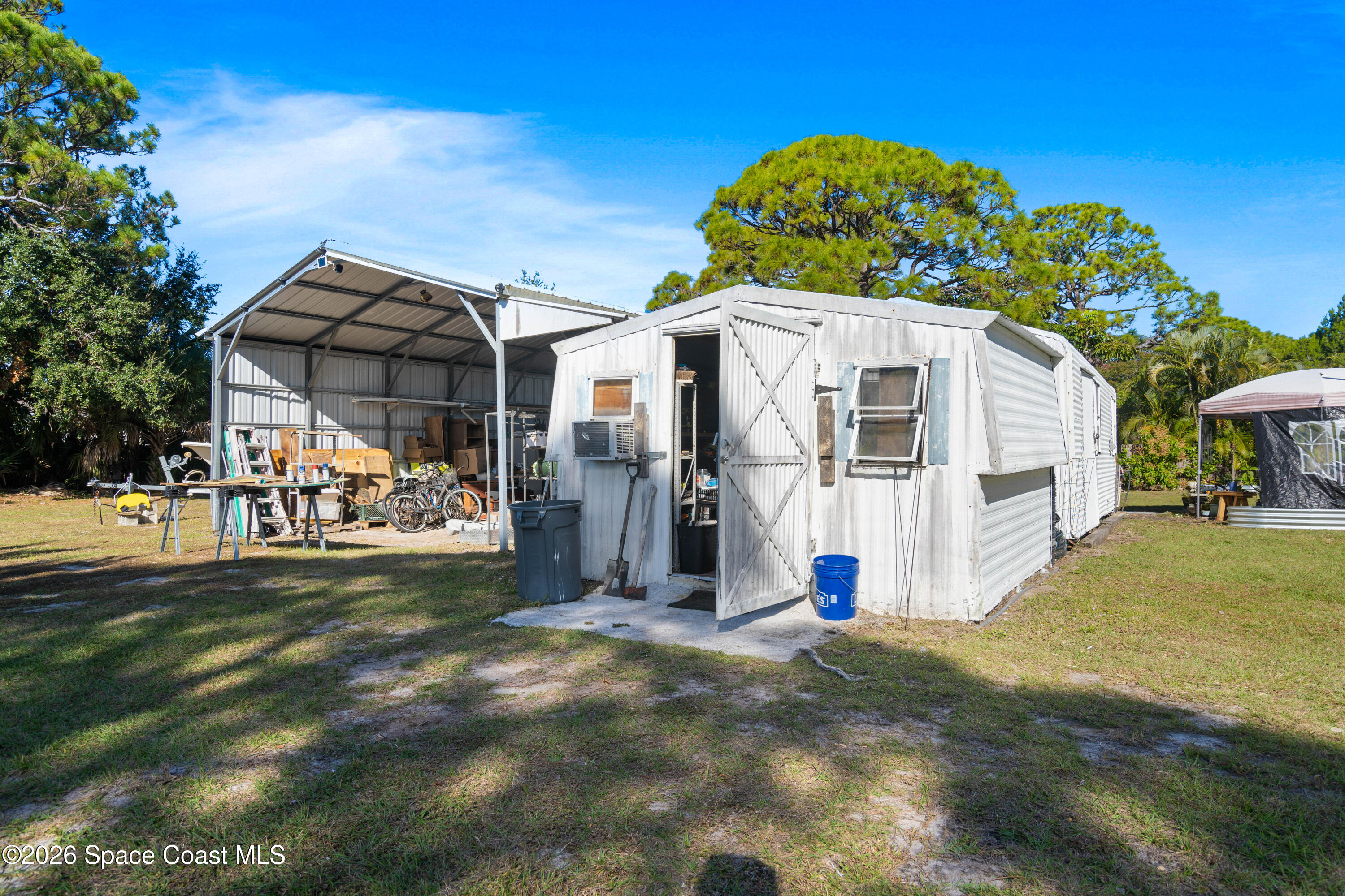 8280 Pine Ridge Trail Sebastian, FL 32976 - Photo 21 of 43 a view of a small yard in front of a house