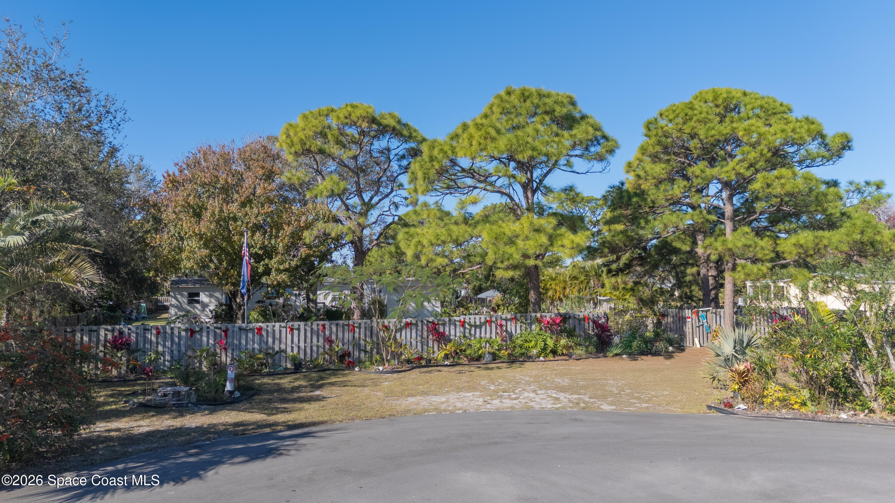 8280 Pine Ridge Trail Sebastian, FL 32976 - Photo 24 of 43 front view of a house with a street