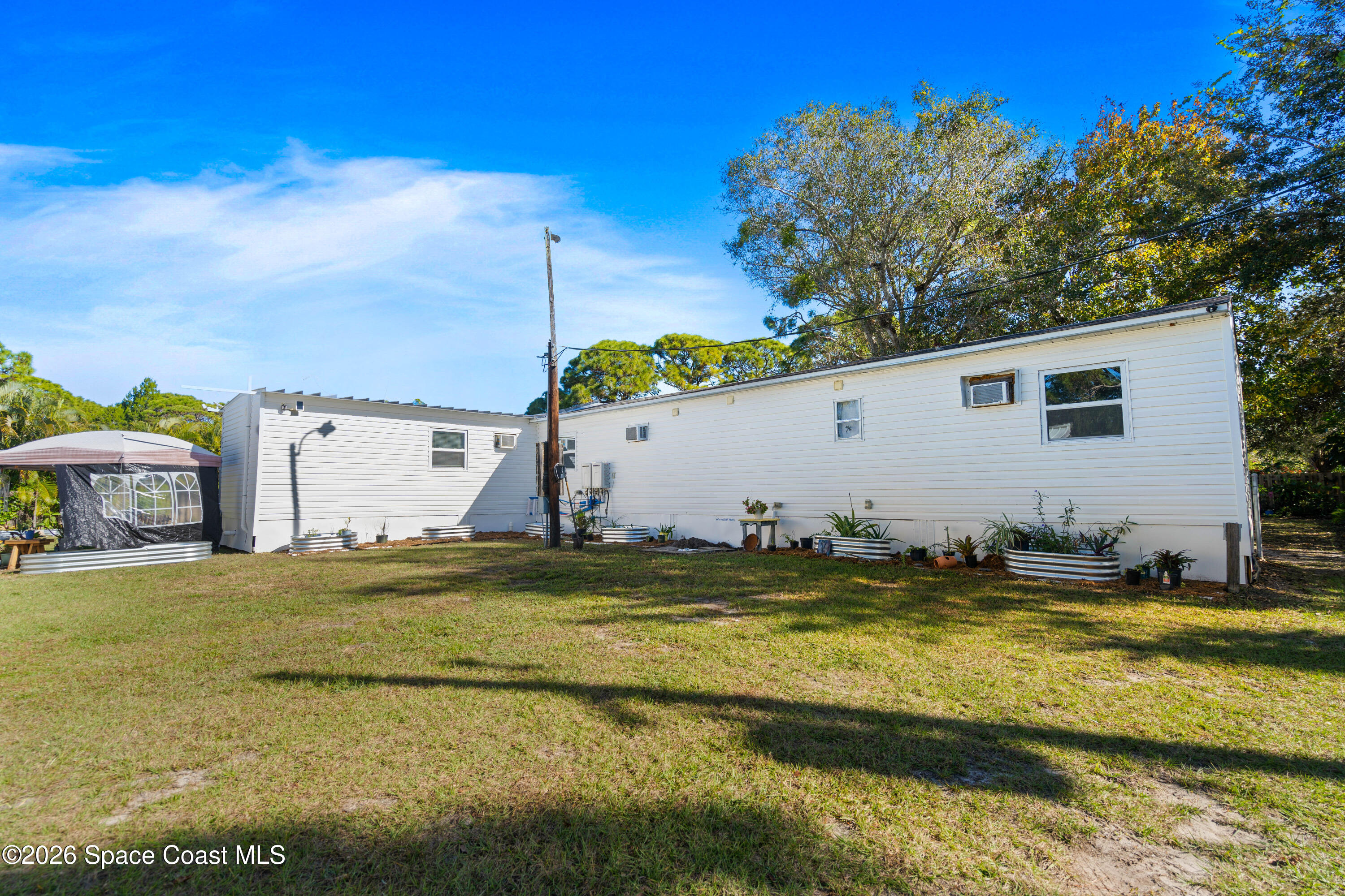 8280 Pine Ridge Trail Sebastian, FL 32976 - Photo 3 of 43 a view of a swimming pool with an outdoor space