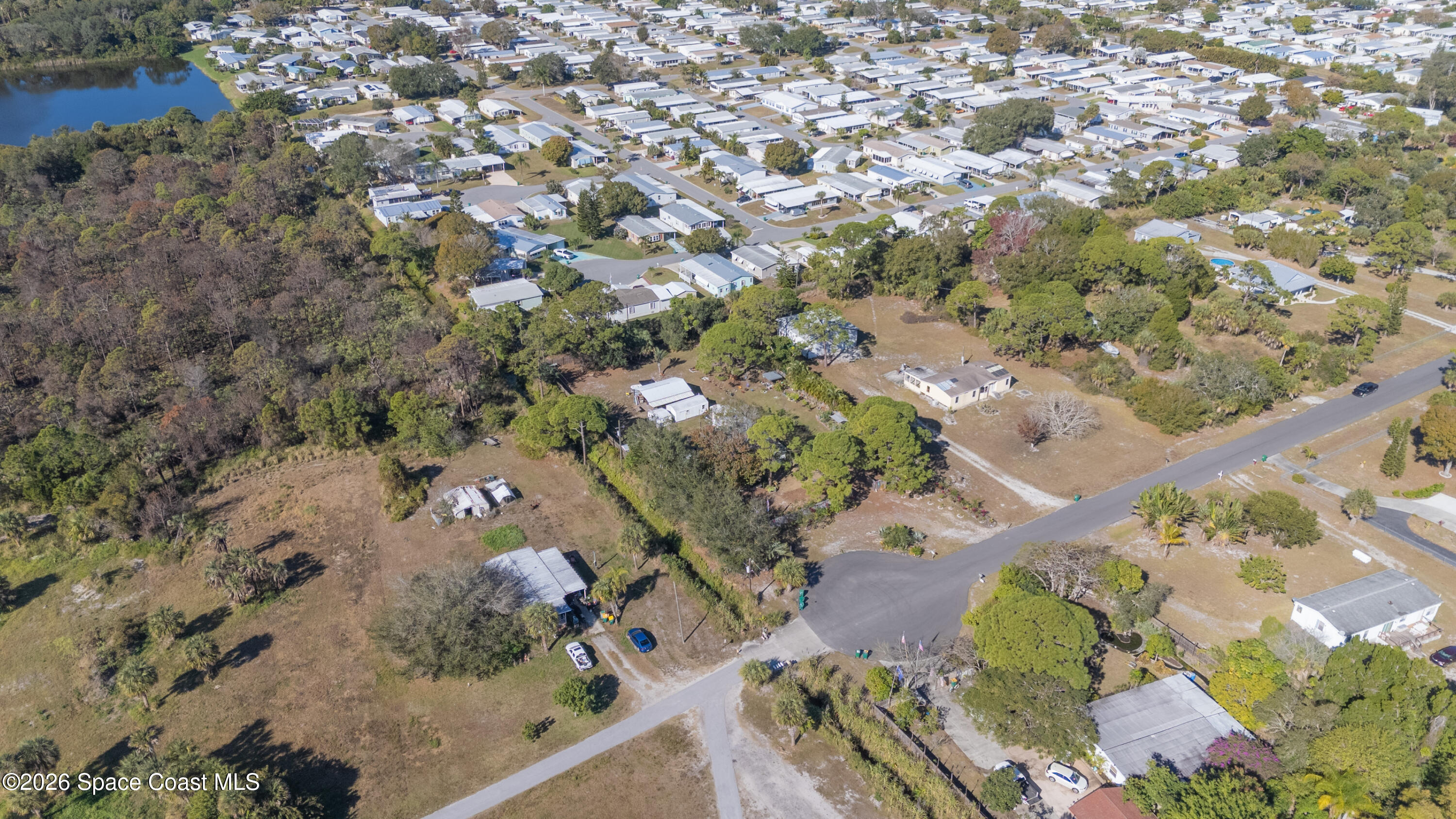 8280 Pine Ridge Trail Sebastian, FL 32976 - Photo 41 of 43 an aerial view of a house with a yard