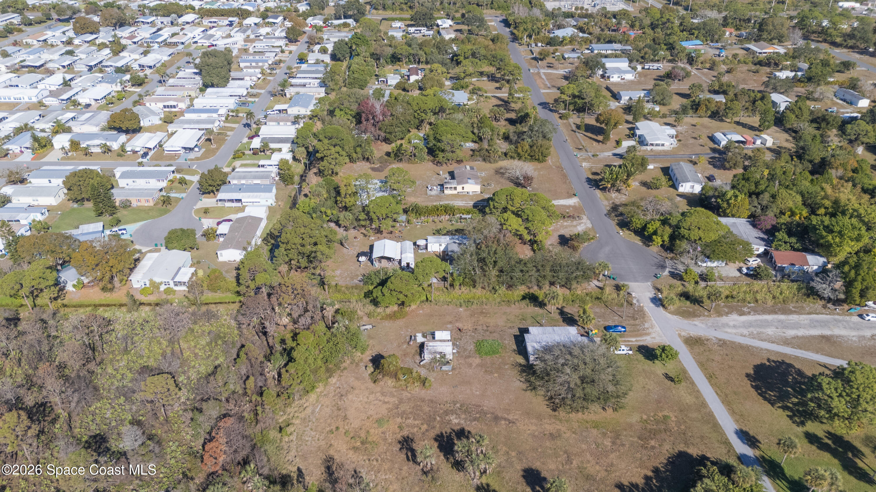 8280 Pine Ridge Trail Sebastian, FL 32976 - Photo 42 of 43 an aerial view of a house with a yard