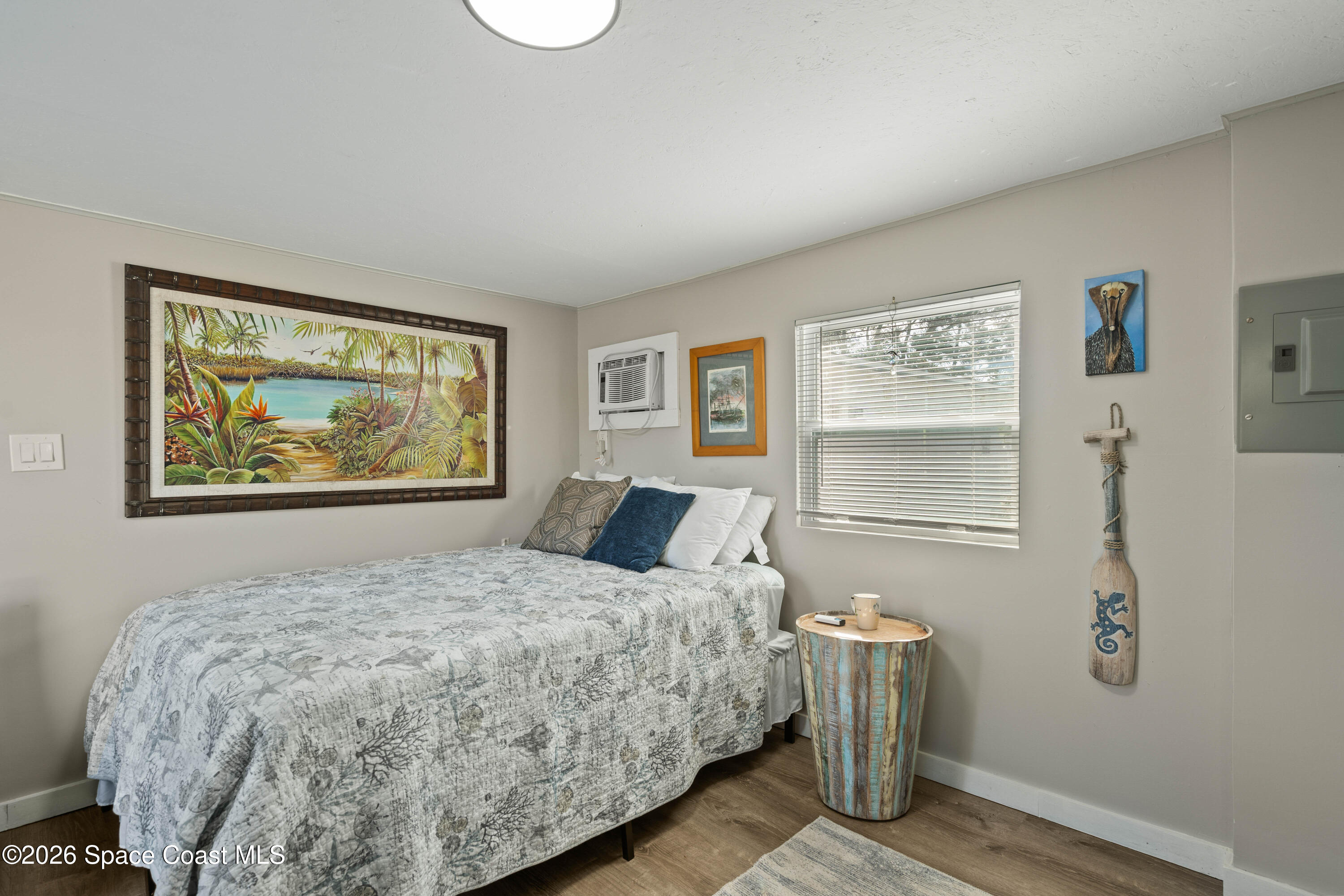 8280 Pine Ridge Trail Sebastian, FL 32976 - Photo 8 of 43 a bedroom with a bed and a window