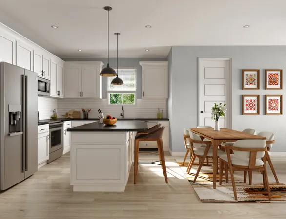 a kitchen with stainless steel appliances granite countertop a table chairs stove and refrigerator