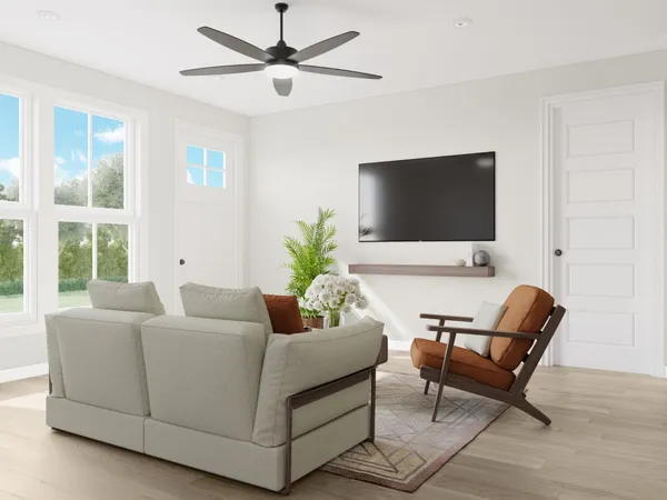 a living room with furniture and a flat screen tv