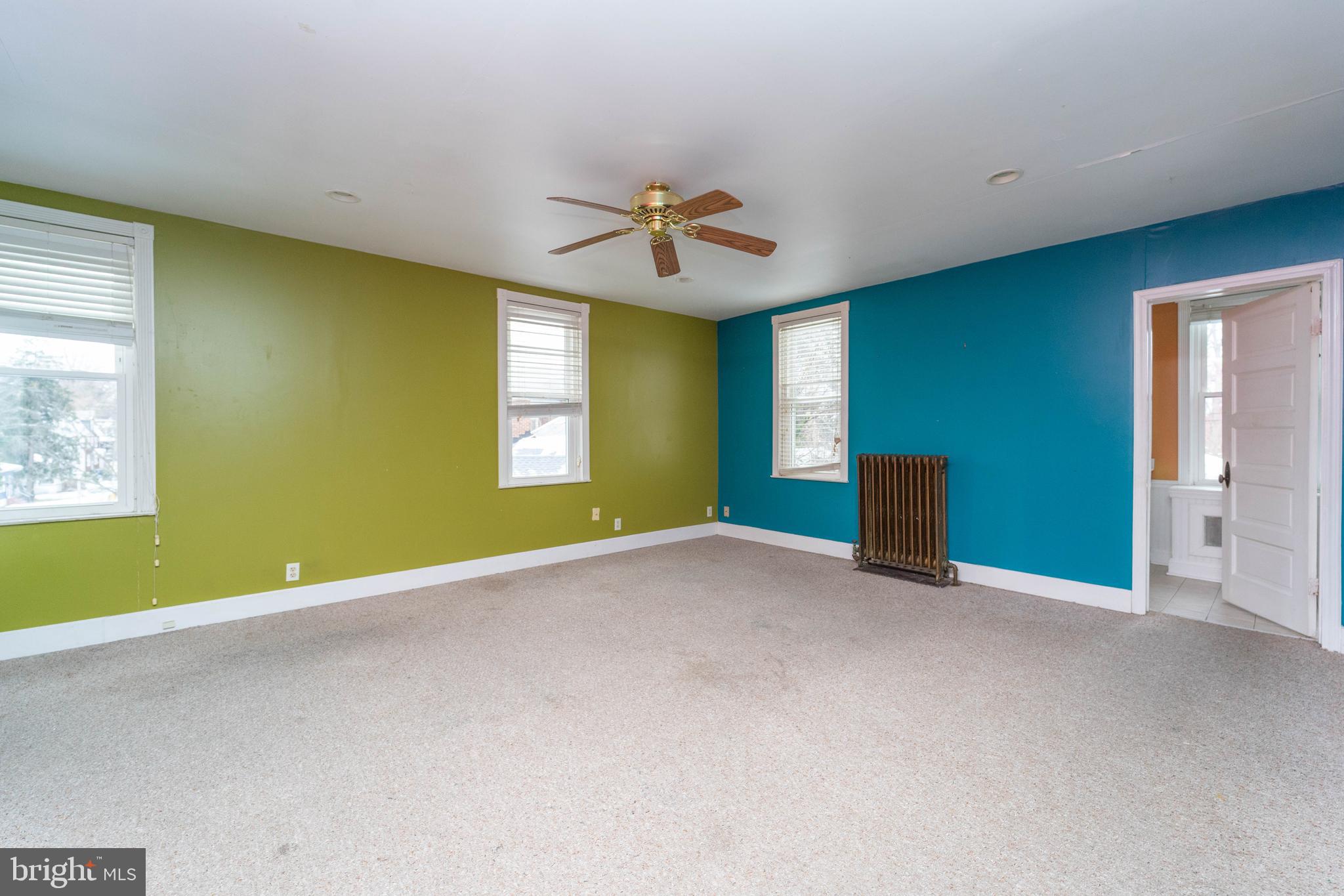 3204 Batavia Avenue Baltimore, MD 21214 - Photo 20 of 31 a view of an empty room with window and a kitchen