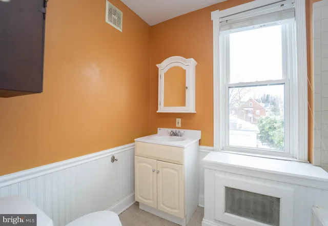 a white bath tub sitting next to a window