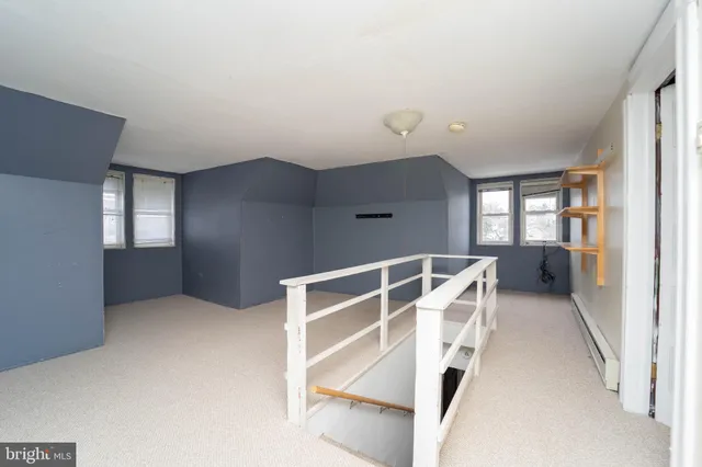 a view of an empty room with stairs