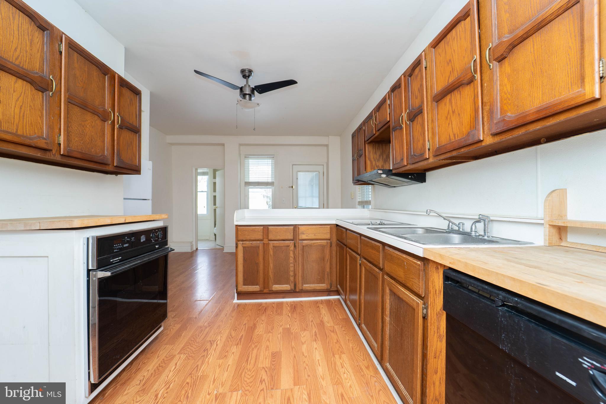 3204 Batavia Avenue Baltimore, MD 21214 - Photo 7 of 31 a kitchen with stainless steel appliances granite countertop a sink stove and cabinets