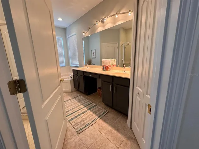 a bathroom with sink and mirror