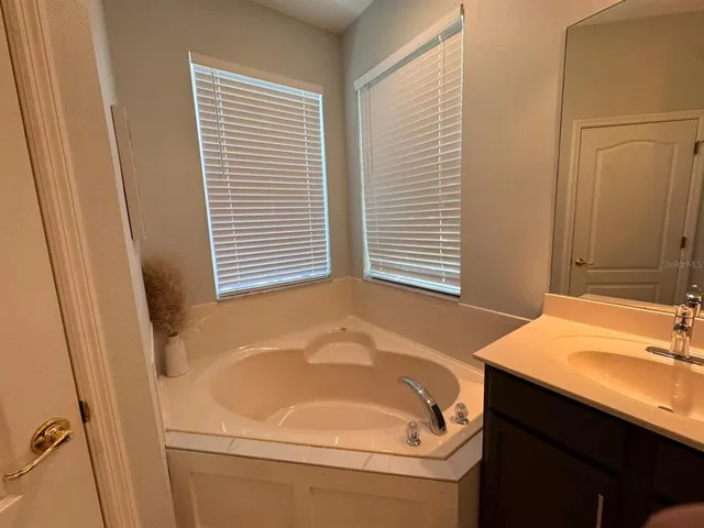 a bathroom with a sink and a bathtub