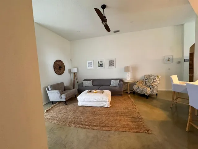 a bedroom with bed and a chandelier