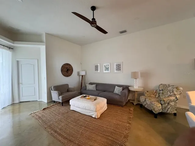 a bedroom with furniture and a window