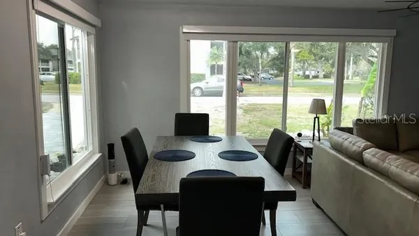 a view of a dining room with furniture window and outside view