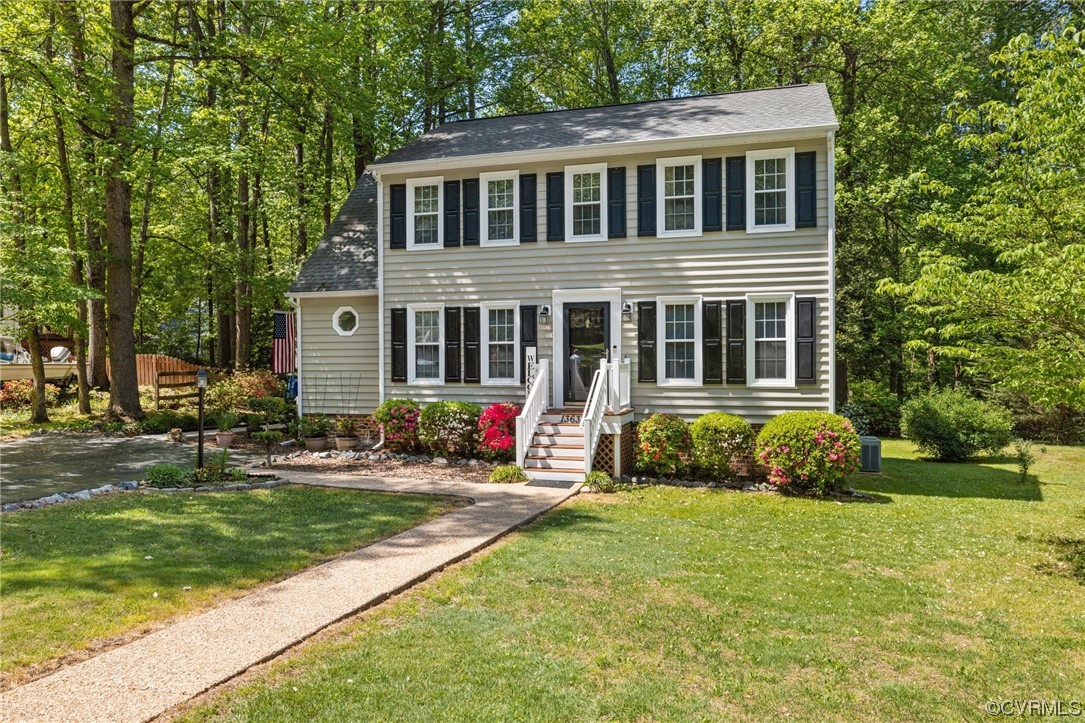 13637 Decidedly Court Midlothian, VA 23112 - Photo 1 of 25 a front view of a house with a yard and garage