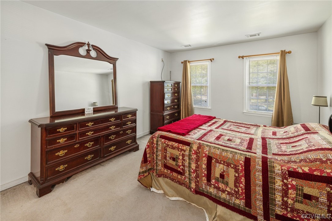 13637 Decidedly Court Midlothian, VA 23112 - Photo 15 of 25 a bedroom with a bed and a mirror on dresser