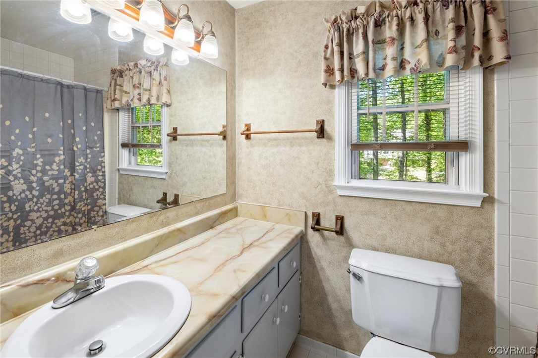 13637 Decidedly Court Midlothian, VA 23112 - Photo 17 of 25 a bathroom with a sink and a mirror