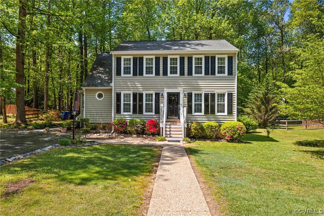 13637 Decidedly Court Midlothian, VA 23112 - Photo 2 of 25 a front view of a house with a yard and trees