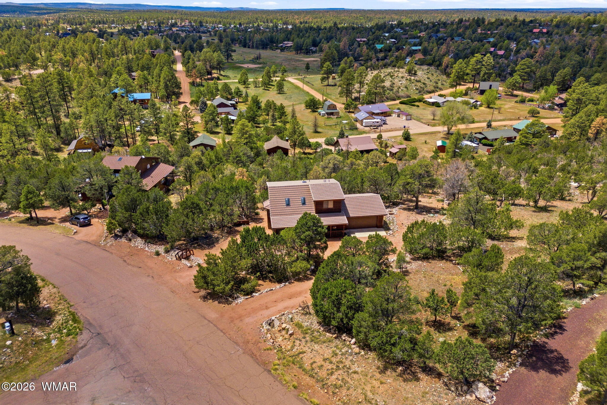 2806 Sky Hawk Drive Overgaard, AZ 85933 - Photo 2 of 43 an aerial view of residential house with parking space