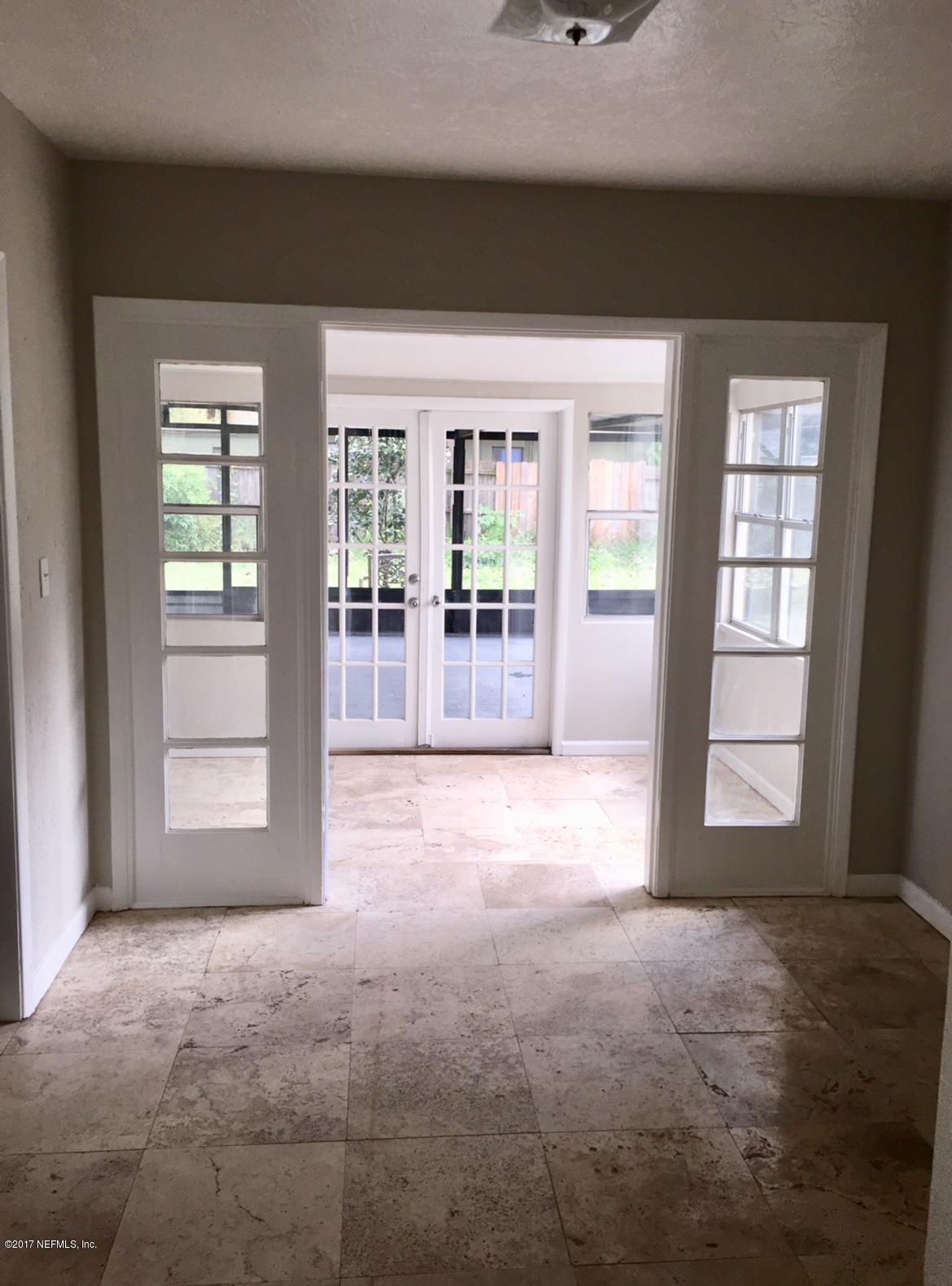 6145 Colgate Road Jacksonville, FL 32217 - Photo 3 of 12 a view of an empty room with a window