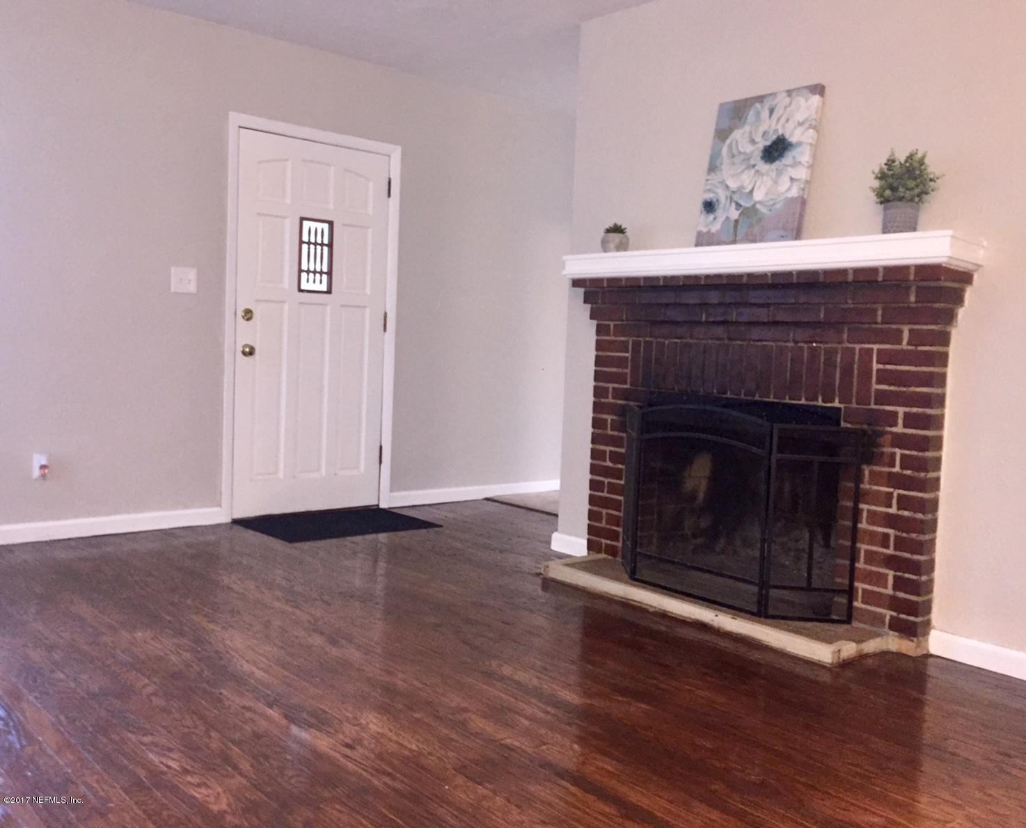 6145 Colgate Road Jacksonville, FL 32217 - Photo 8 of 12 a living room with a fireplace