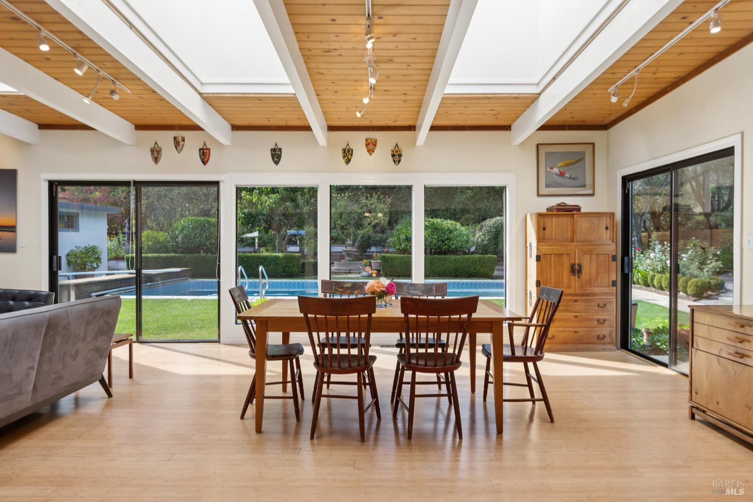 1030 Yell Road Glen Ellen, CA 95442 - Photo 19 of 73 a view of a dining room with furniture large windows and wooden floor