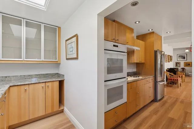 a kitchen with a sink and large window