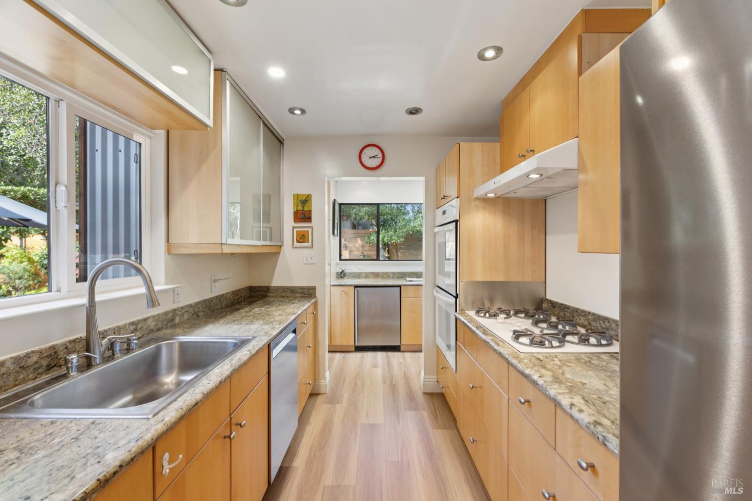 1030 Yell Road Glen Ellen, CA 95442 - Photo 28 of 73 a kitchen with stainless steel appliances kitchen island granite countertop a sink stove cabinets and wooden floor