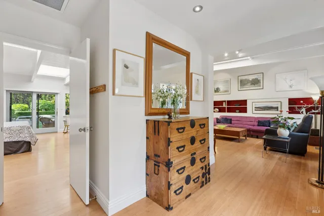 a bedroom with a large bed and a large window